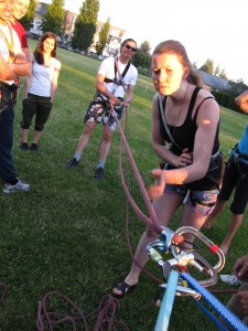 Christina inspects an assisted hoist setup.