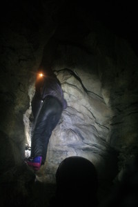 Adriana climbs into a side passage. Photo credit: Jannu Casonova.