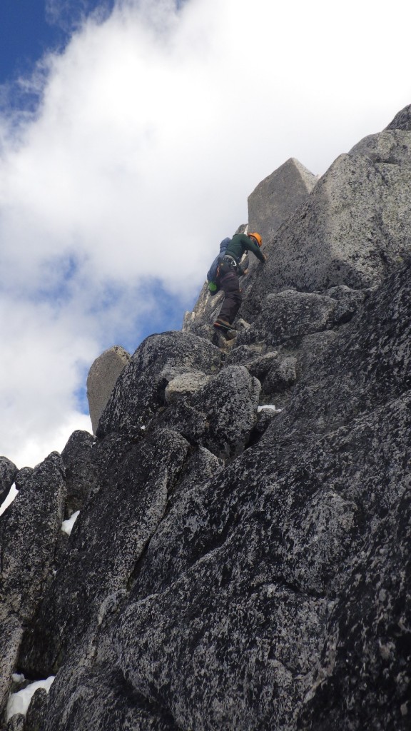 Artem down-climbing on the West Ridge. Photo by: Cora Skaien.