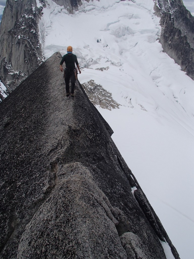 Artem walking across the classic ridge on the West Ridge of Pigeon Spire. Photo by: Jeff Taylor.