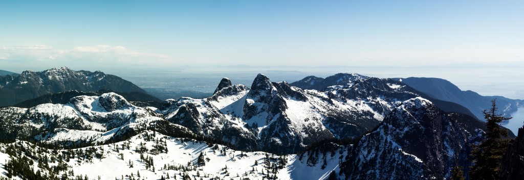 The Crown Mountain group (left), the Lions (centre), and Mount Harvey (bottom-right).