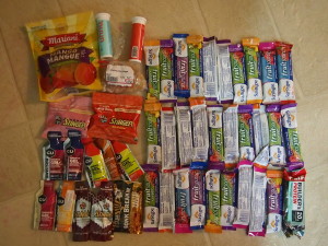 1.8 kg of mostly-sugar. Note the single non-sugar item (protein bar) in the bottom corner. I tried to eat it at the halfway point and my body refused.