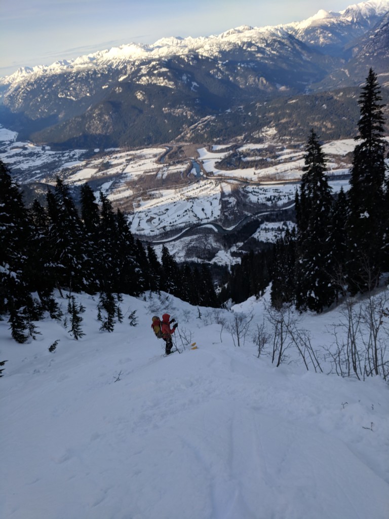 Nick following old ski tracks. Less snow, more trees. Still a ways from the truck.