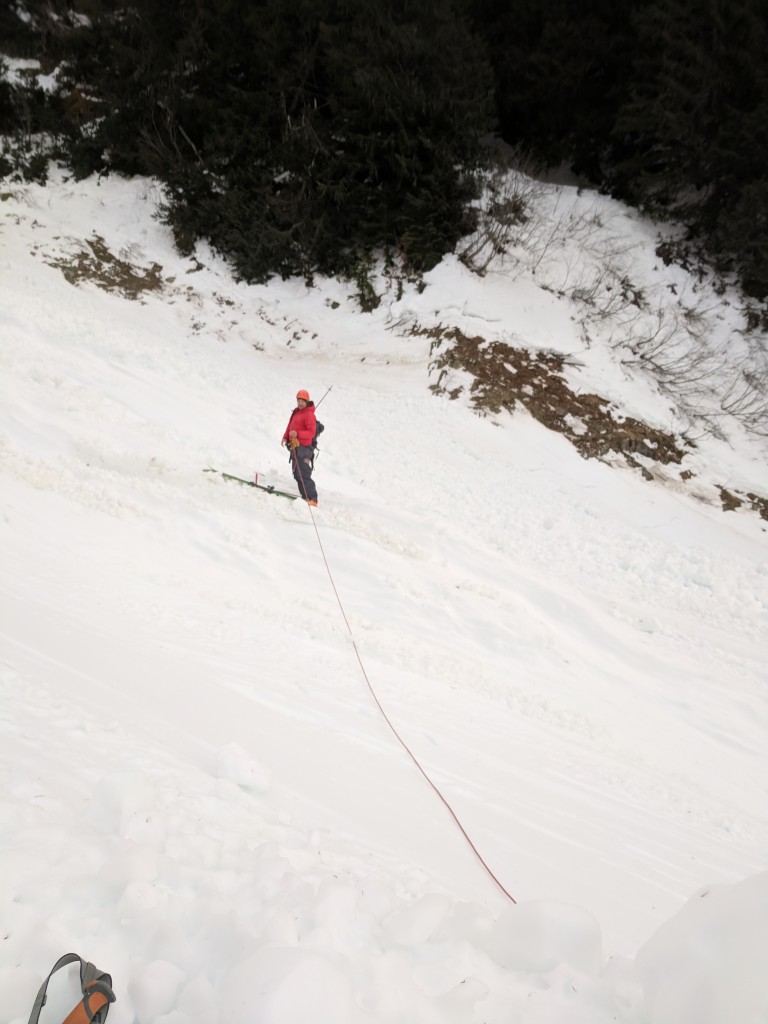 Learning from Nick's difficulties crossing in ski boots, I opt to cross on skis. We walked to a higher, flatter section. We had a rope, so we belayed. Trivial with metal ski edges. 