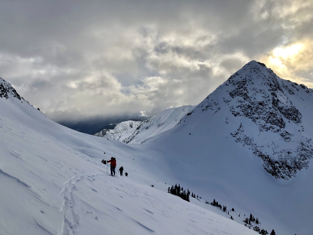 Skinning back up the wind scoured alpine. Peak 2222 on the right.