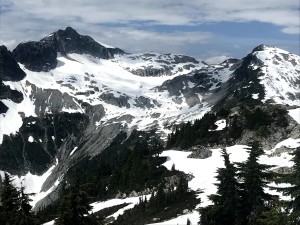 As seen from the Brew area: Cypress peak, and the glacier bowl that we would descend.  We camped by the lowest oint in the ridge, then skied/walked down the obvious zigzag of least steep snowy terrain, then down the scree slope that drains the bowl.