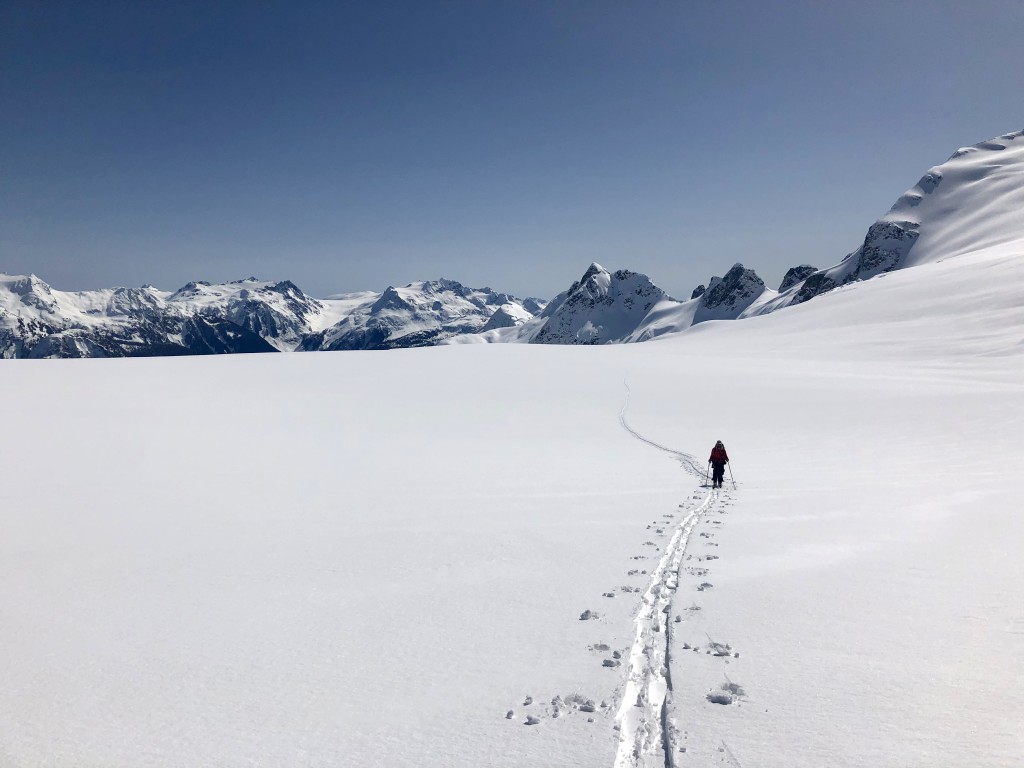 Julien plodding up the Mamquam Icefield with part of the Misty Icefield Traverse in the background.