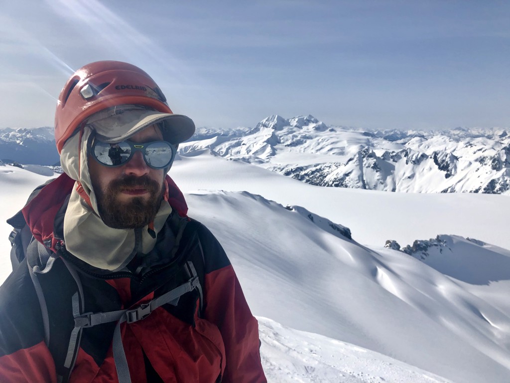 Julien on the ~2370m summit in the middle of the Mamquam Icefield with Garibaldi in the background.