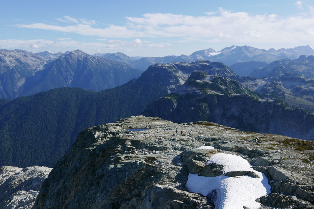 Walking the ridge. The minor peak we went up is the flat-topped one in the middle, not quite on the horizon.