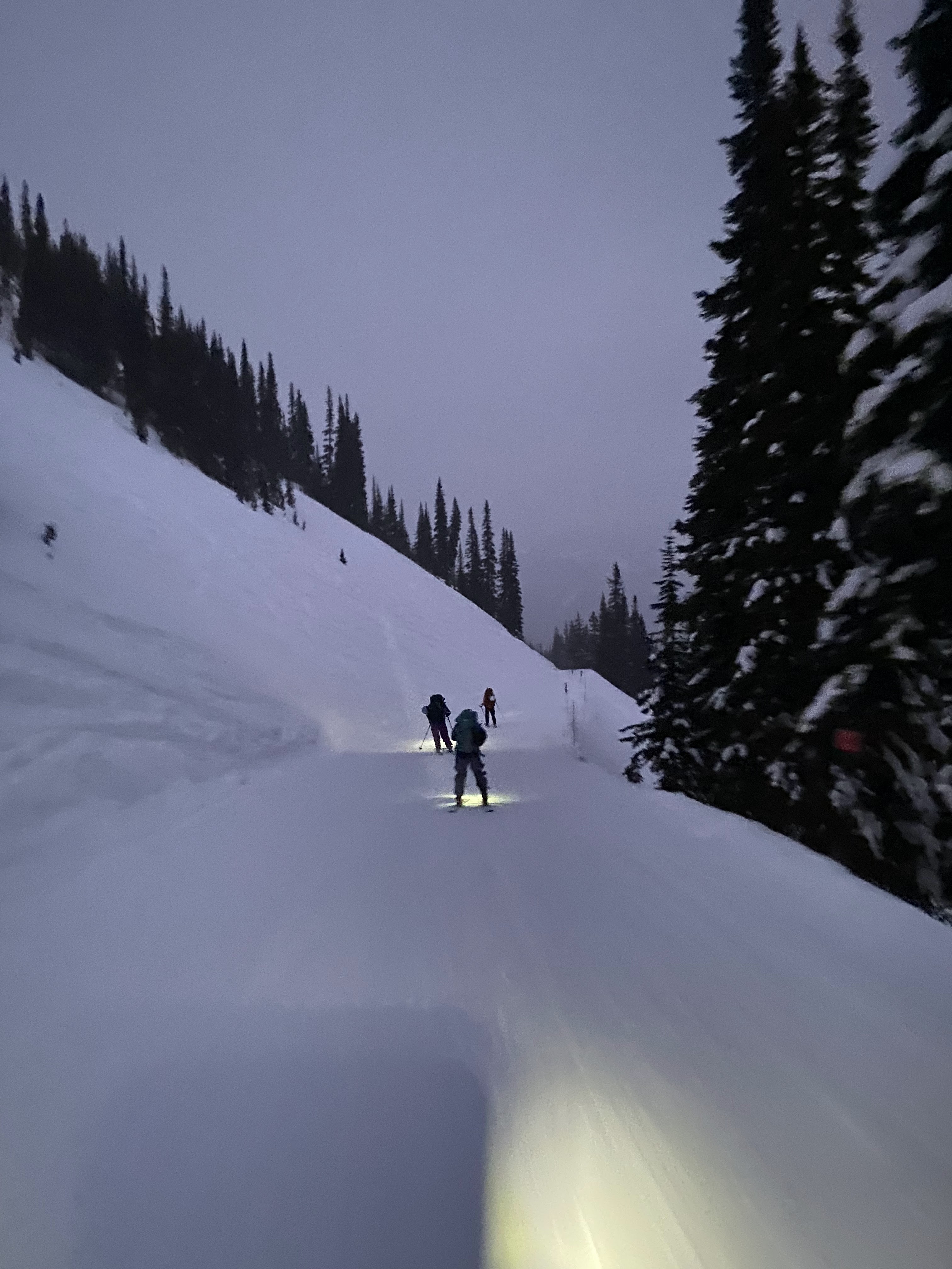 Skiing by headlamp. Photo by Luke