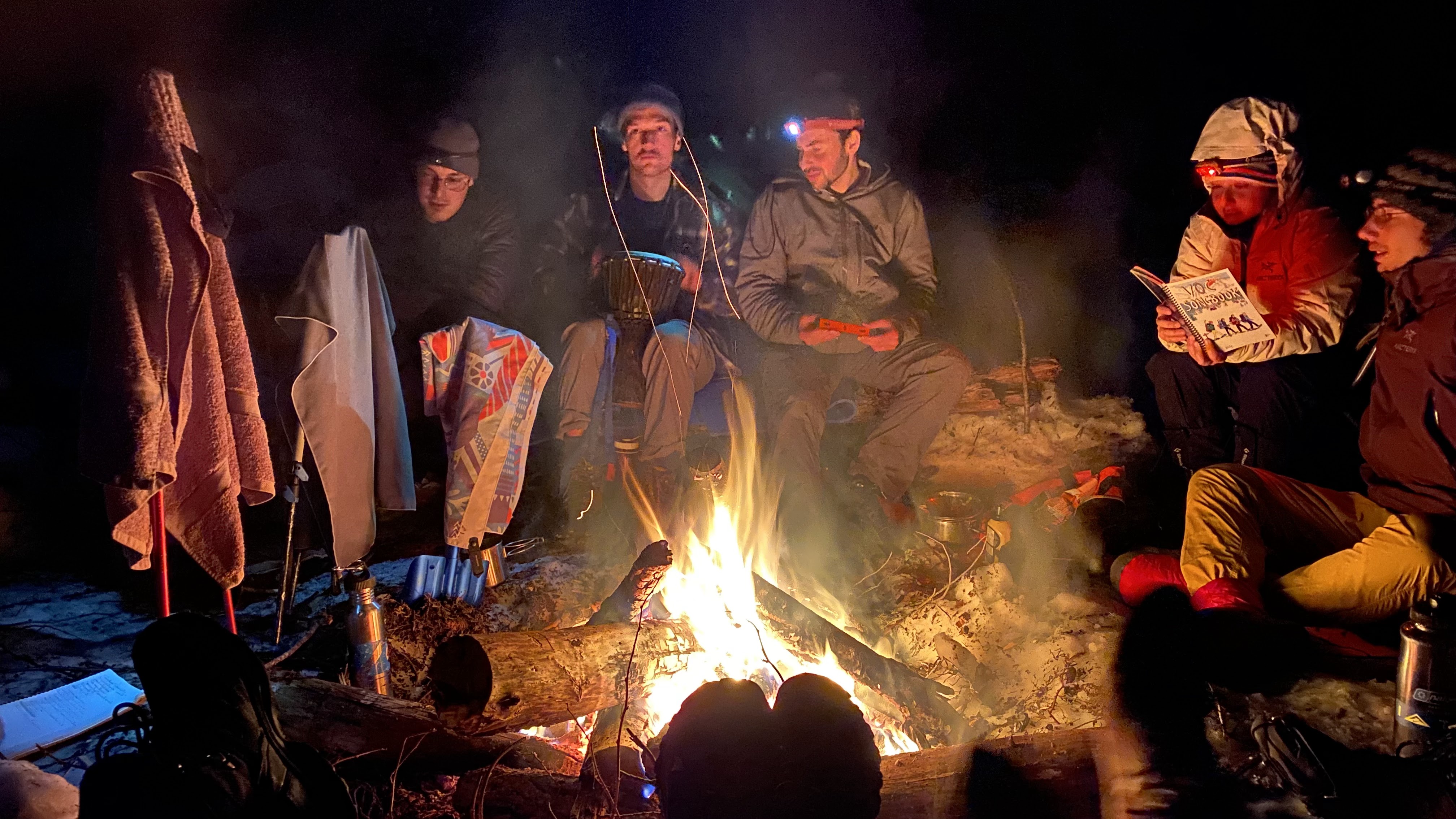 Singing around the fire. Bringing extra VOC songbooks would've been a move. Photo by Siddharth