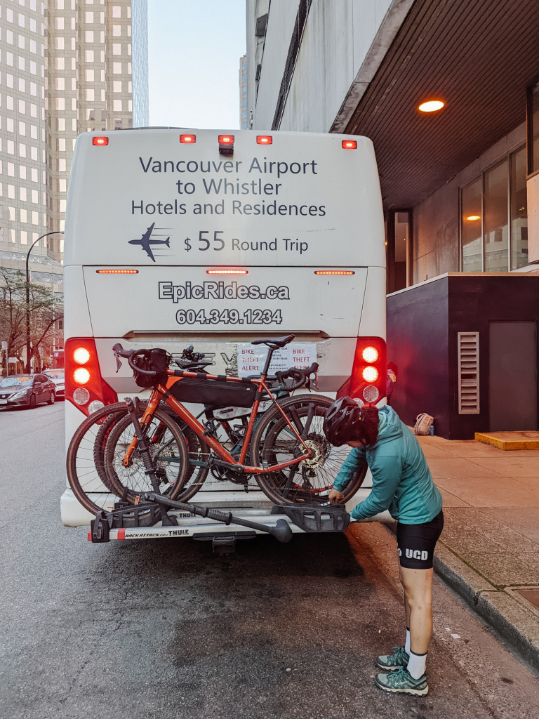 Bikes are mounted behind the bus like this