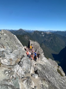 The 18-strong crew a few metres below the peak. Perfect photo op.