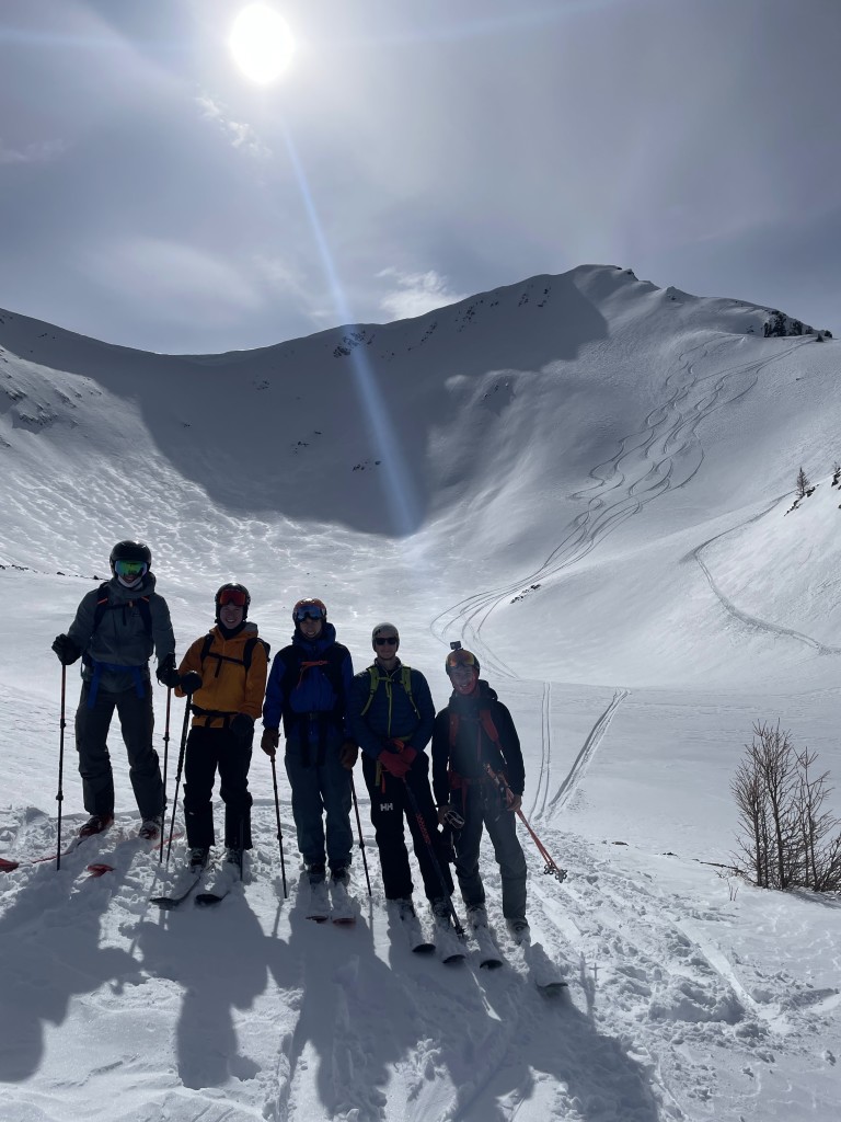 Group posing in front of our ski tracks