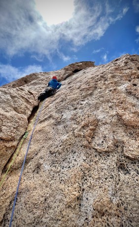 Steve approaching the runout undercling traverse on pitch 3