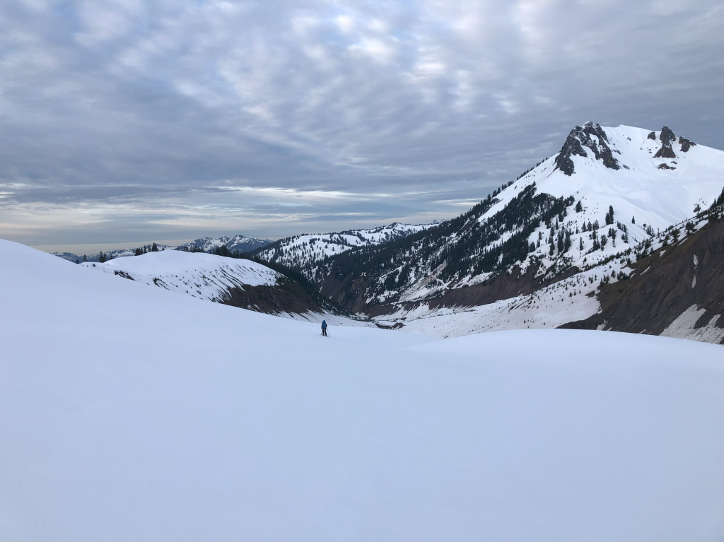 Dropping down off one of the toes of the glacier into the Ring Creek drainage. As our next move, we decided to climb up and over The Gargoyles (right).