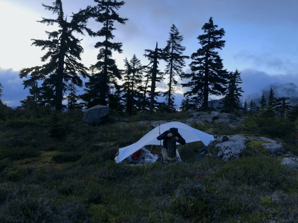 Packing up camp in the morning with frozen fingers.