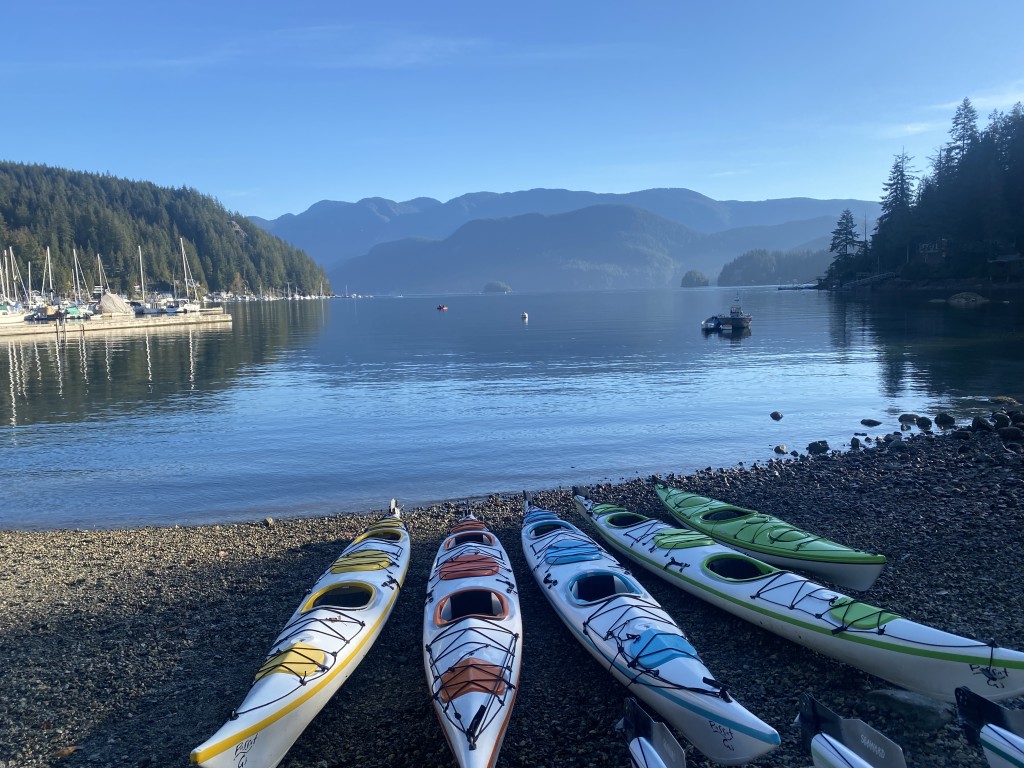 Kayaks lined up at Deep Cove before launching