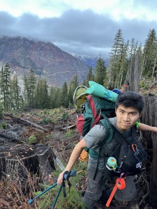 Joseph with the trail tape, clearly enjoying the bushwhack. PC: Sophie Wigman