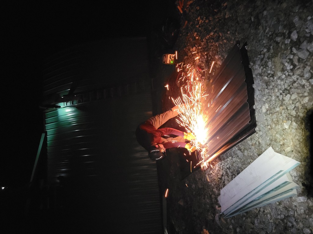 Jacob cutting up spare sheet metal for storage. PC: Anton Afanassiev