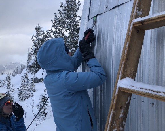 Stuffing butyl tape into the gaps. PC: Duncan MacIntyre