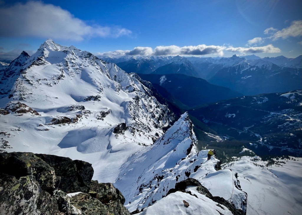 Evan follows along the crest of the S Ridge