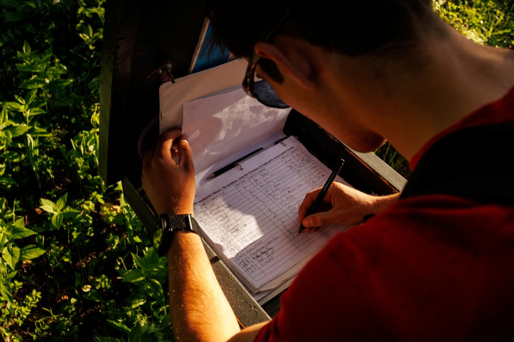 Don't forget to sign in/out when climbing on Yam. (Photo: Evan Wong)