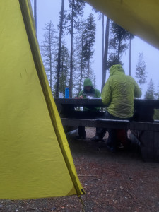 Joanna and Lukas having dinner in the rain, seen from the comfort of my sleeping bag