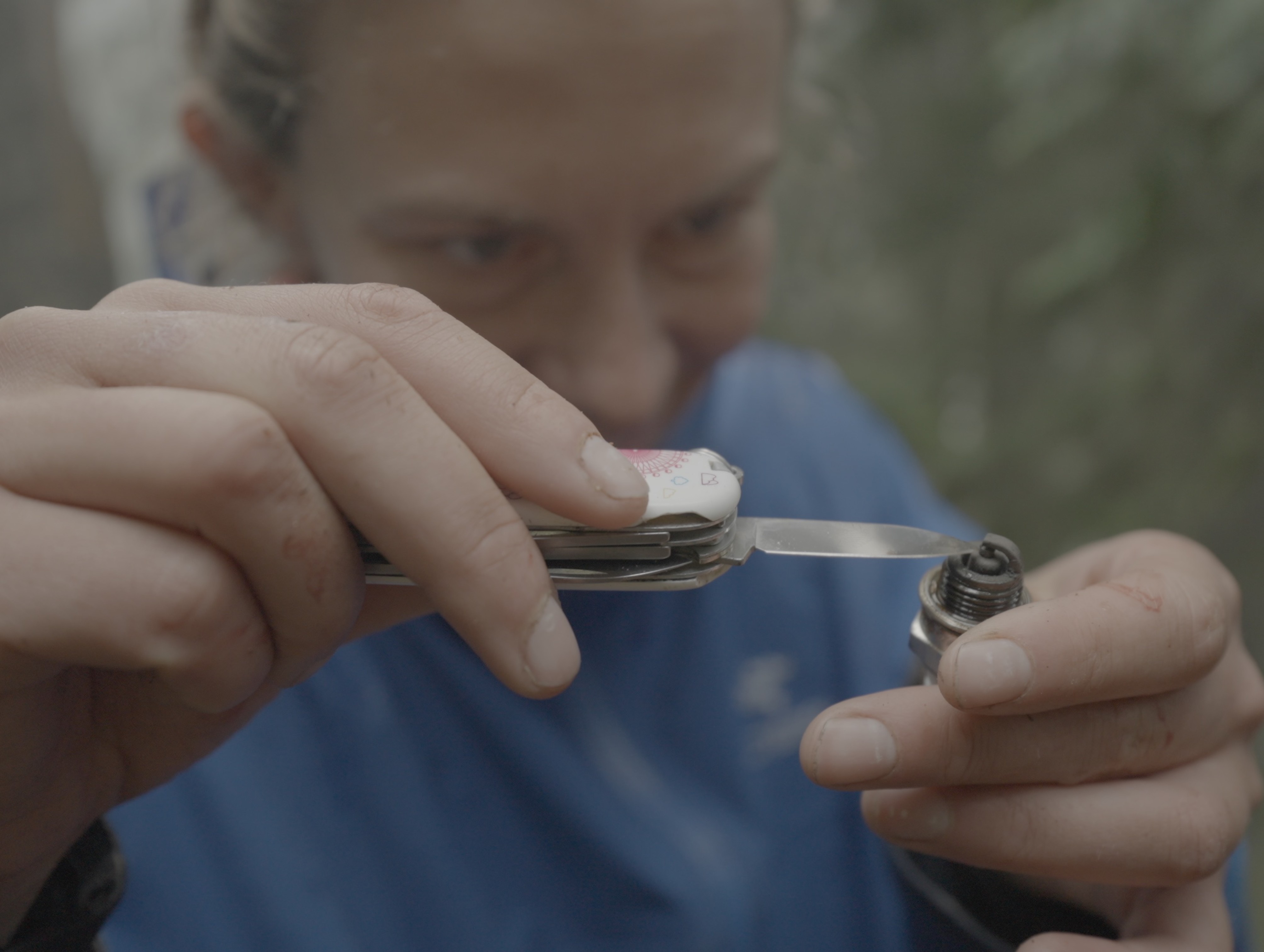 Cassandra performing field surgery on the spark plug (Alexi L))